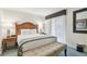 Bright bedroom featuring a bed, stylish bench seating, and comfortable side tables at 36750 Us Highway 19 # 24209, Palm Harbor, FL 34684