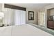 Comfortable bedroom featuring a king-size bed, soft lighting, and a neutral color palette at 36750 Us Highway 19 # 24209, Palm Harbor, FL 34684