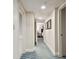Hallway with multiple doors and carpeted flooring at 36750 Us Highway 19 # 24209, Palm Harbor, FL 34684