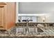 Kitchen features granite countertops and stainless steel sink at 36750 Us Highway 19 # 24209, Palm Harbor, FL 34684