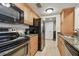 Well-equipped kitchen with stainless steel appliances and wood cabinets at 36750 Us Highway 19 # 24209, Palm Harbor, FL 34684