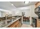 Kitchen with stainless steel appliances, and granite countertops, next to dining area at 36750 Us Highway 19 # 24209, Palm Harbor, FL 34684