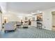 Open-concept living space showcasing a comfortable seating area next to the kitchen at 36750 Us Highway 19 # 24209, Palm Harbor, FL 34684