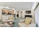 Inviting living room with kitchen view, modern television, and comfortable armchairs at 36750 Us Highway 19 # 24209, Palm Harbor, FL 34684