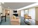 Living room with a television, chairs, and a coffee table at 36750 Us Highway 19 # 24209, Palm Harbor, FL 34684