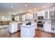 Modern kitchen featuring white cabinets, marble countertops, and stainless steel appliances at 4141 Courtside Way, Tampa, FL 33618