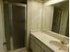 Bathroom with shower, vanity, and floral wallpaper at 4708 Lacrosse Ct, New Port Richey, FL 34655