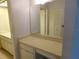 Bathroom vanity with mirror and cabinets at 4708 Lacrosse Ct, New Port Richey, FL 34655