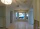 Spacious dining room with bay window and tile floor at 4708 Lacrosse Ct, New Port Richey, FL 34655