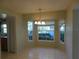 Bright dining room with a large window and tile floor at 4708 Lacrosse Ct, New Port Richey, FL 34655