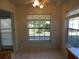 Cozy dining area with large windows and tile flooring at 4708 Lacrosse Ct, New Port Richey, FL 34655