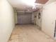 Empty garage with overhead door and ceiling fan at 4708 Lacrosse Ct, New Port Richey, FL 34655