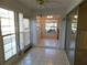 Bright sunroom with tile floors and multiple windows at 4708 Lacrosse Ct, New Port Richey, FL 34655