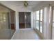 Spacious sunroom with tile floors and access to multiple rooms at 4708 Lacrosse Ct, New Port Richey, FL 34655