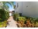 Welcoming entryway with walkway and lush landscaping at 4902 Carranza Ct, Tampa, FL 33616