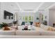 Spacious living room with sectional sofa, fireplace, and access to backyard at 4902 Carranza Ct, Tampa, FL 33616