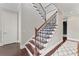 Wood and wrought iron staircase with hardwood floors at 4902 Carranza Ct, Tampa, FL 33616