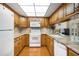 Kitchen boasts granite countertops and oak wood cabinets at 537 5Th Se St, Largo, FL 33771