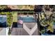 Aerial view showing a home with a screened-in pool at 5709 Camila Song Ln, Tampa, FL 33625