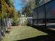 Spacious backyard with lush landscaping and a screened-in pool area at 5709 Camila Song Ln, Tampa, FL 33625