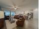 Open living room and kitchen with modern appliances and hardwood floors at 5709 Camila Song Ln, Tampa, FL 33625