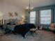 Bright main bedroom with a king-size bed and decorative accents at 5709 Camila Song Ln, Tampa, FL 33625