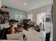 Home office with a large desk, comfortable chair, and natural light at 5709 Camila Song Ln, Tampa, FL 33625