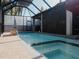 Enjoy the sun or shade in this screened-in pool area at 5709 Camila Song Ln, Tampa, FL 33625