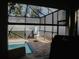 Relaxing pool area with covered patio and grill at 5709 Camila Song Ln, Tampa, FL 33625