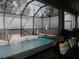 Inviting pool and spa with covered patio and seating at 5709 Camila Song Ln, Tampa, FL 33625