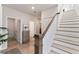 Modern staircase with wooden railing and light flooring at 5747 Desert Rose Pl, Tampa, FL 33615