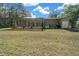 Large backyard with screened pool and shed at 628 Erin Way, Brooksville, FL 34601