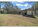 Large backyard with grassy area and shed at 628 Erin Way, Brooksville, FL 34601