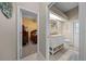 Clean bathroom with single vanity, toilet, and access to backyard at 628 Erin Way, Brooksville, FL 34601