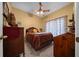 Guest bedroom with a double bed and ceiling fan, offering a tranquil space at 628 Erin Way, Brooksville, FL 34601