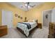 Cozy bedroom featuring a full-size bed, ceiling fan, and neutral color scheme at 628 Erin Way, Brooksville, FL 34601