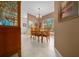 Bright dining room features a chandelier and wood table with chairs at 628 Erin Way, Brooksville, FL 34601