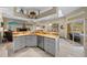 Island kitchen with granite countertops, stainless steel appliances, and breakfast bar at 628 Erin Way, Brooksville, FL 34601