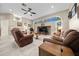 Relaxing living room with comfortable seating and a media center at 628 Erin Way, Brooksville, FL 34601