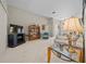 Living room with a TV, comfy couch and decorative shelving at 628 Erin Way, Brooksville, FL 34601
