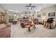 Open concept living room and kitchen with hardwood floors at 628 Erin Way, Brooksville, FL 34601