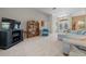 Spacious living room with light grey carpet, comfy couch and a built-in bookcase at 628 Erin Way, Brooksville, FL 34601