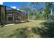 Screened pool area with lush landscaping at 628 Erin Way, Brooksville, FL 34601