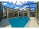 Inviting pool and spa area with screened enclosure at 628 Erin Way, Brooksville, FL 34601