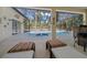 Poolside patio with lounge chairs and bar at 628 Erin Way, Brooksville, FL 34601