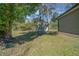 Metal storage shed in the backyard at 628 Erin Way, Brooksville, FL 34601