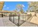 Inviting pool area with a statue and safety fence at 6805 Ambassador Ct, Tampa, FL 33615