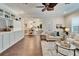 Open living room, hardwood floors, view of dining room at 6920 Crestpoint Dr, Apollo Beach, FL 33572