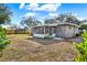 House exterior view showcasing the backyard and screened porch at 7095 17Th N Way, St Petersburg, FL 33702