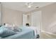 Bright bedroom with a light teal comforter and built-in closet at 7095 17Th N Way, St Petersburg, FL 33702